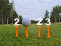 Golf 2023 and New Year number with golf ball on a grassy field