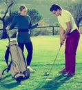 Golf partners playing together