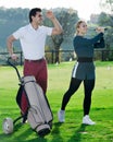 Golf partners playing together