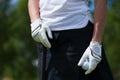 Golf player gloves hold the iron or putter