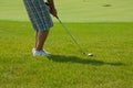 Golf player on green Royalty Free Stock Photo