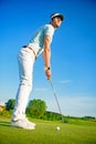 Golf player holding clud Royalty Free Stock Photo