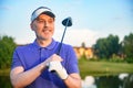 Golf player holding driver Royalty Free Stock Photo