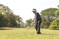 Golf player pitching golf ball in the air. Royalty Free Stock Photo