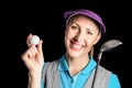 Golf player posing with a golf club and golf ball Royalty Free Stock Photo