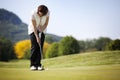 Golf player putting ball. Royalty Free Stock Photo