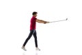 Golf player in a red shirt taking a swing isolated on white studio background Royalty Free Stock Photo