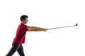 Golf player in a red shirt taking a swing isolated on white studio background Royalty Free Stock Photo