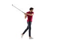 Golf player in a red shirt taking a swing isolated on white studio background Royalty Free Stock Photo