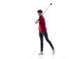 Golf player in a red shirt taking a swing isolated on white studio background Royalty Free Stock Photo