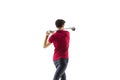 Golf player in a red shirt taking a swing isolated on white studio background Royalty Free Stock Photo