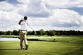 Golf player teeing off Royalty Free Stock Photo