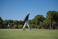 Golf player walking and carrying bag Royalty Free Stock Photo