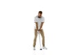 Golf player in a white shirt practicing, playing isolated on white studio background Royalty Free Stock Photo