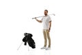 Golf player in a white shirt practicing, playing isolated on white studio background Royalty Free Stock Photo