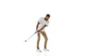 Golf player in a white shirt practicing, playing isolated on white studio background Royalty Free Stock Photo