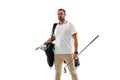 Golf player in a white shirt practicing, playing isolated on white studio background Royalty Free Stock Photo