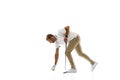 Golf player in a white shirt practicing, playing isolated on white studio background Royalty Free Stock Photo