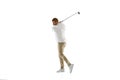 Golf player in a white shirt taking a swing isolated on white studio background Royalty Free Stock Photo