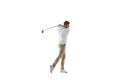 Golf player in a white shirt taking a swing isolated on white studio background Royalty Free Stock Photo