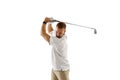 Golf player in a white shirt taking a swing isolated on white studio background Royalty Free Stock Photo
