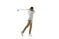 Golf player in a white shirt taking a swing isolated on white studio background Royalty Free Stock Photo
