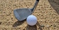 Golf players hitting ball with sandblasting closeup Royalty Free Stock Photo