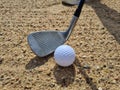 Golf players hitting ball with sandblasting closeup Royalty Free Stock Photo