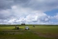 Golf players with their carts, on cloudy day, 31 May, Hafnafjordur, Iceland