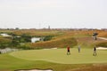 Golf playground - green grass with people Royalty Free Stock Photo