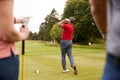 Golf Professional Demonstrating Tee Shot To Group Of Golfers During Lesson Royalty Free Stock Photo