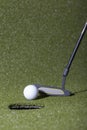 Golf putt on a green field Royalty Free Stock Photo