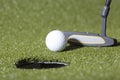 Golf putt on a green field Royalty Free Stock Photo