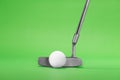 Golf Putter with Ball on a Green Background Royalty Free Stock Photo