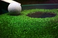 Golf and with putter on green background Royalty Free Stock Photo