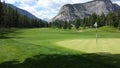 Golf putting green in mountains Royalty Free Stock Photo