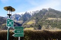 Golf resort signs indicating assembly point and directions with majestic mountains in the background Royalty Free Stock Photo