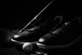 Golf shoes on isolated black background.