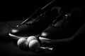 Golf shoes on black background.