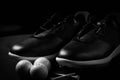 Golf shoes on isolated black background