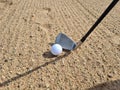 Golf shot from sand bunker golfer hitting ball from danger Royalty Free Stock Photo