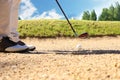 Golf shot from sand bunker golfer hitting ball from hazard Royalty Free Stock Photo