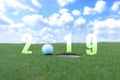 Golf sport conceptual image.Happy new year 2019. Golf ball on the green fairway, blue sky background.