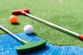 Golf stick and ball on green grass close up. Royalty Free Stock Photo