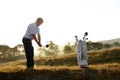 Golf, stroke and man with driver outdoor on course for training, workout or fitness at sunset mockup space. Golfing Royalty Free Stock Photo