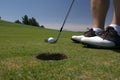 Golf about to putt Royalty Free Stock Photo