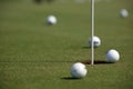 Golf tournament - golf balls and flag Royalty Free Stock Photo