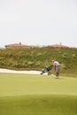 Golf tournament - golf player, golf cart Royalty Free Stock Photo