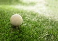 Golfball on green grass golf course, close up view Royalty Free Stock Photo