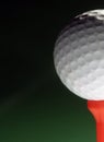 Golfball on red tee Royalty Free Stock Photo